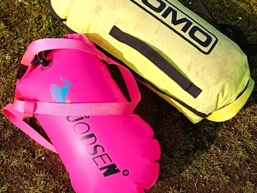 two inflatable tow floats sat on the beach